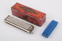A Hohner Super Chromonica chromatic harmonica in box, Hohner harmonica (C) and 7x whistles (2xBb, F,