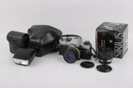 An Olympus OM10 35mm SLR camera outfit. With two lens; an Olympus 50mm f1.8, and a Sirius 28mm f2.8.