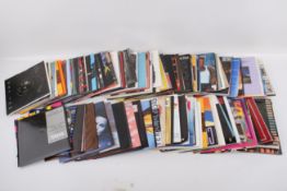 Two boxes of assorted seven inch vinyl single records mostly 1980s.