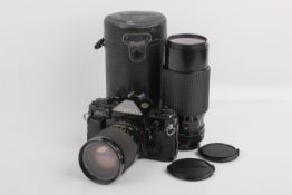A Canon A1 35mm SLR camera outfit. Black. Serial number 1289474.