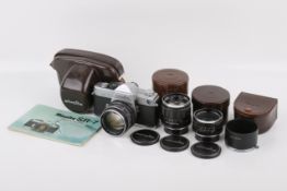 A Minolta SR-7 35mm SLR camera outfit. Chrome. Serial number 2085956.