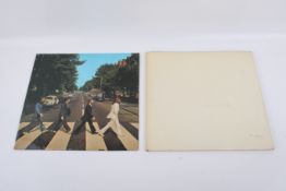 Two Beatles LP records.