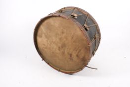A 19th or early 20th century large military bass drum. Wooden shell, hand painted and rope tensions.