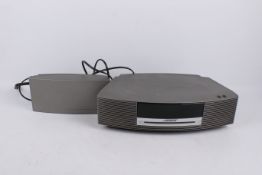 A Bose Wave Music System. Including radio, CD player and DAB module, remotes and power supply, etc.