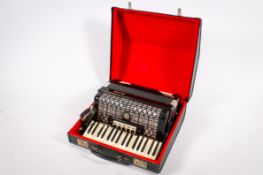 A mid-century Galotta Ideal piano bass accordian in case. With shoulder straps.