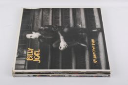 Seven assorted LP vinyl records - Elton John and Billy Joel.