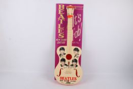 A vintage The Beatles Selcol 'New Sound' toy guitar. No.