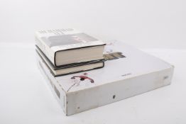 A group of three books related to heavy weight boxing.