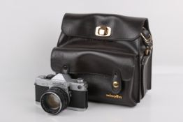 A Minolta SR-7 35mm SLR camera. Chrome. Serial number 2233650. With a Minolta 58mm f1.