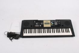 A Yamaha YPT-220 portable digital 61-key piano keyboard.
