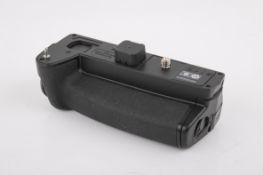 An Olympus HLD-7 Power Battery Grip. In good cosmetic condition. Not tested on camera.