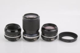 Three Nikon camera lenses. To include a Nikkor 28mm f2.