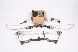 An assortment of modern archery equipment with two bows with accessories.