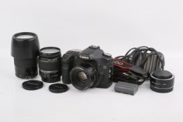 A Canon EOS 50D Digital SLR camera outfit. With three lenses; a Canon EF 50mm f1.