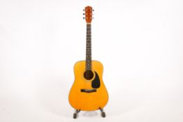 A Fender DG5NAT accustic guitar on stand.