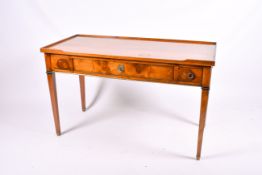 A 20th century Georgian style oak writing table or desk with three drawers.