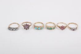 A collection of five 9ct and one 9ct and silver rings.