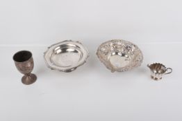 Four white metal table items.