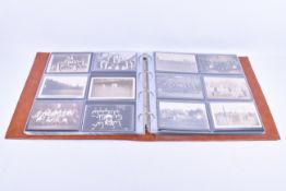 An album containing vintage postcards.