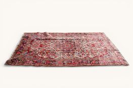 A 20th century Persian Heriz rug.