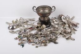 A collection of silverplated tableware. Including a trophy, thistle condiment holder and cutlery.