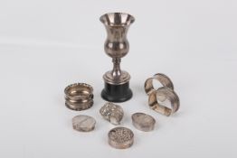 A collection of silver and white metal items.