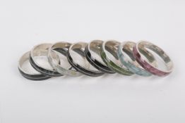 Eight matching silver and stone set bangles.