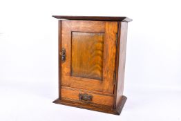 An oak smoker's cabinet.