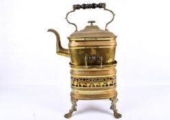 A Victorian brass kettle on stand.