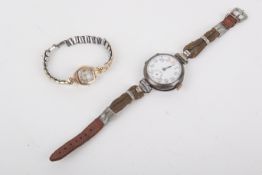 A 14ct gold vintage lady's wristwatch and a WWI period Trench watch.