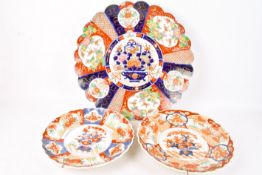 Three early 20th century Japanese Imari scalloped edge plates.