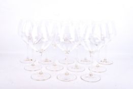 A set of twelve Riedel Restaurant Poppy Pinot Noir wine glasses.