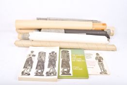 A collection of brass rubbings and relevant books.