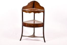 A Georgian mahogany three tier corner washstand.