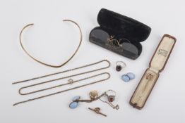 A small group of yellow metal items.