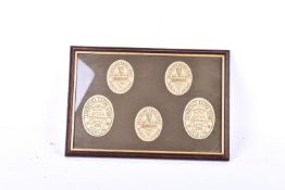 A framed set of five vintage Guiness bottle labels - F E Norris, Bath.