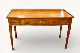 A 20th century Georgian style oak writing table or desk with three drawers.