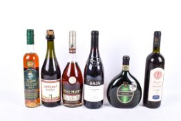 Six bottles of assorted alcohol.