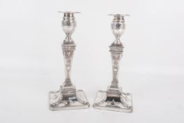 A pair of silverplated candlesticks.