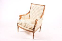 A 20th century Louis XVI style mahogany armchair with contemporary upholstery.