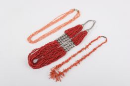 Three coral necklaces with base metal fittings.