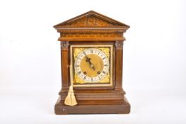 An early 20th century mahogany cased architectural style mantel clock.