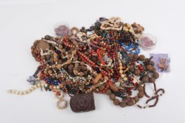 A collection of beads and costume jewellery.