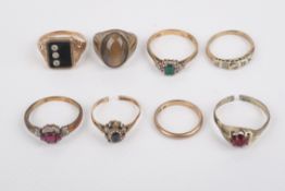 Eight assorted gold and silver rings.