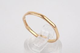 A 22ct gold wedding band.