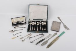 A box of six silver spoons and assorted silverplated cutlery.