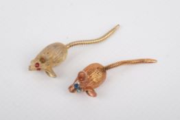 Two small articulated mice brooches.
