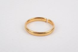 A 22ct gold wedding band (cut). Hallmarked, size circa L, weight 3.2g.