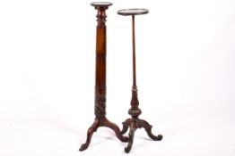 Two Victorian mahogany torchiere stands.