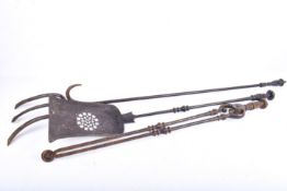 A set of three fire irons tools. Including a pair of tongs, a shovel and a fork.